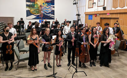 Students accepting applause after their performance