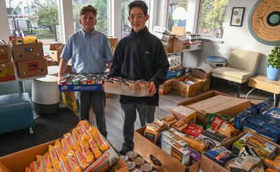 Middle School students load donations collected during Can Construction