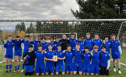 Our Senior Boys Soccer team with the third place trophy