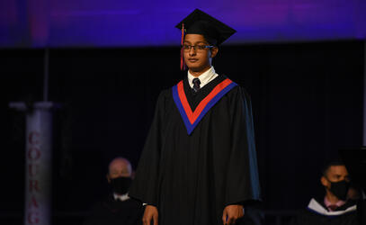 Nekhil Govender on stage at graduation
