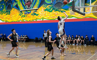 A player jumps for the hoop