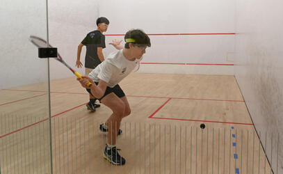 Anderson and Lucas playing squash in the SMUS squash courts 