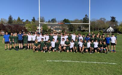 SMUS and Central Coast Grammar players stand together after the game