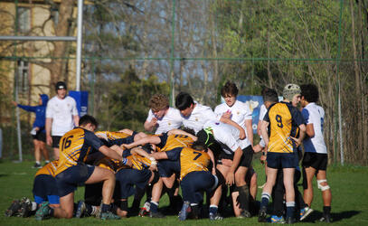 The SMUS Boys team put down a scrum against European opposition