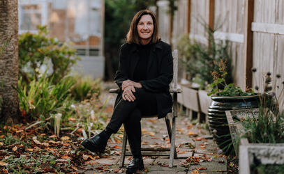 Shelly Berlin sitting in a garden