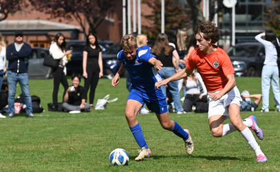 A SMUS player evades the opposition defender