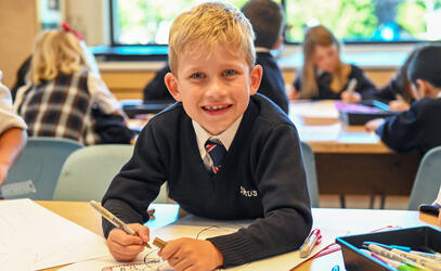 Junior School student colours in class