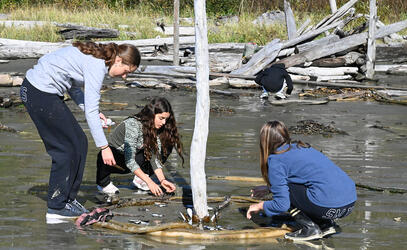 Grade 10 students create art on the beach in Tofino