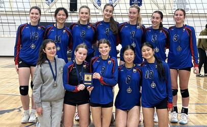 A team photo of the Senior Girls Volleyball team with their silver medals at the AA Island Championships hosted in Comox.