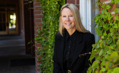 A portrait of Shara Campsall next to an ivy-covered brick building