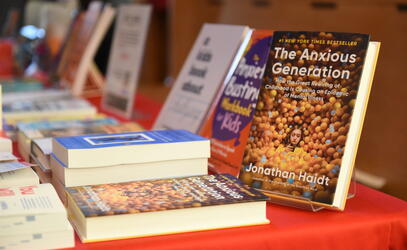 Jonathan Haidt's bestseller book The Anxious Generation sits propped on a display table of books.