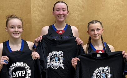 Three Junior Girls basketball players pose with their t-shirt awards