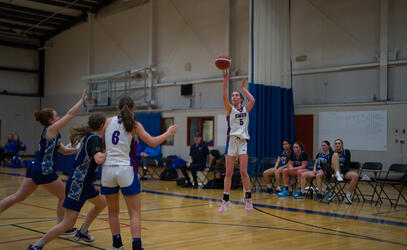 Senior Girls Basketball Charlie Anderson takes a shot in the Double Gym