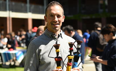 Regan Daly poses with handmade dolls for sale in support of Hope for Youth Uganda