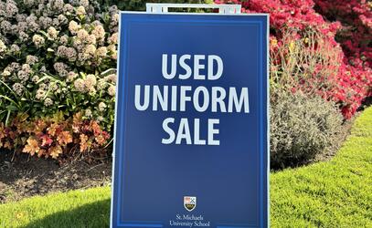 A used uniform sandwich board is on display on campus. 