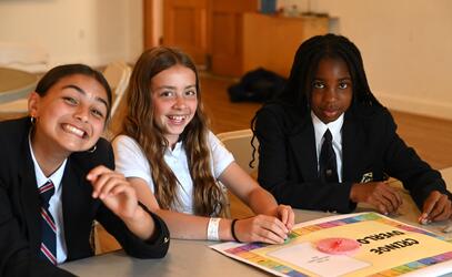 Middle School Girls playing a board game