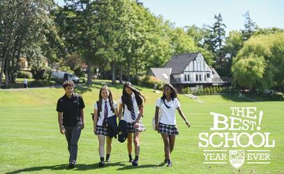 Four students walking on campus