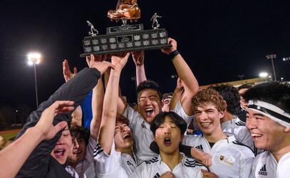 Senior school athletes celebrate soccer win