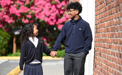 SMUS siblings holding hands