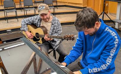 SMUS Alumni Fintan O'Brien '14 and Zack Santella '12 work with student musicians