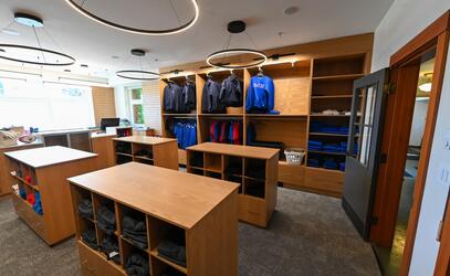 An interior photo of the SMUS campus shop with uniforms on display.