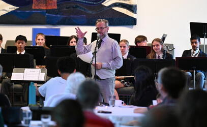 David Enns leads the Middle School band at Shadow and Swing Jazz Night
