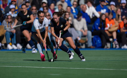 Mackenna Brown battles on the field for UBC Field Hockey