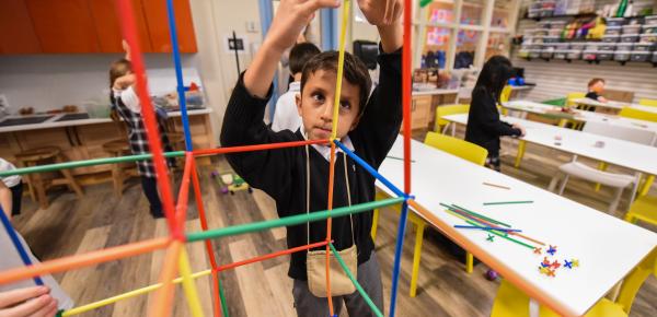 Junior School student erecting a structure in the Imagination Lab