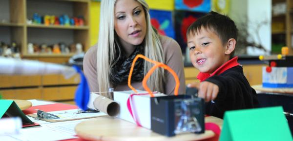 Kindergartener and parent in the classroom