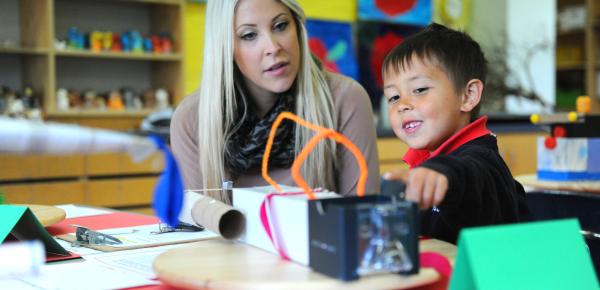 Kindergartener and parent in the classroom