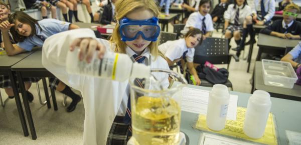 Middle School classroom observing a science experiment