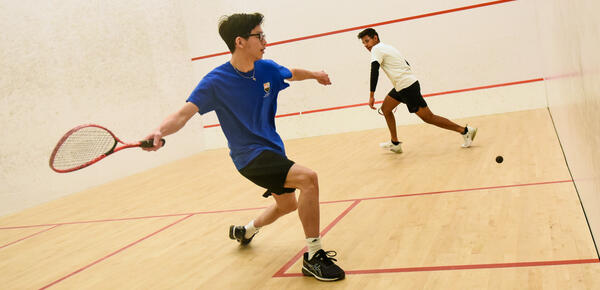 A squash game in the SMUS squash court