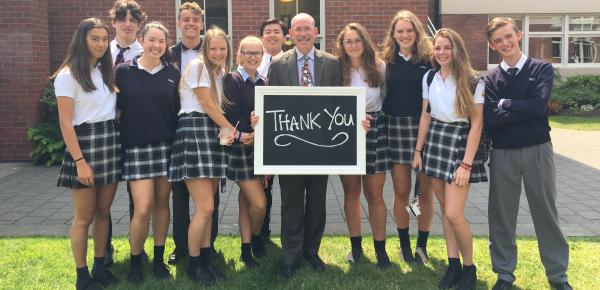 Andy Rodford poses with a group of Senior School students