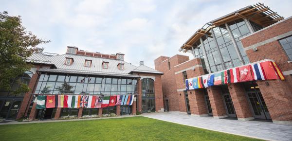 Country flags hanging from Schaffter and Sun Centre buildings