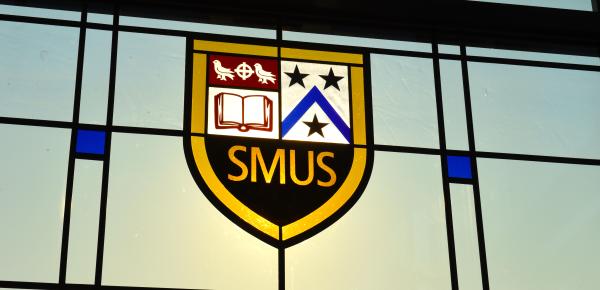 SMUS crest in stained glass