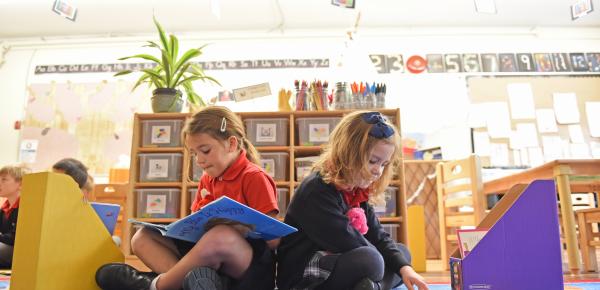 Two Kindergarten students reading
