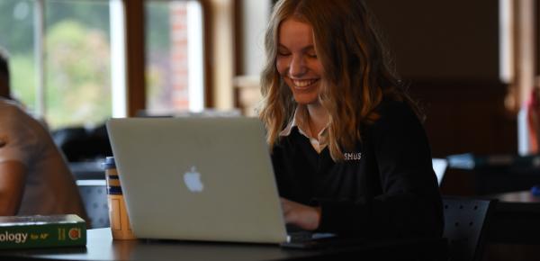 Senior School student working on a laptop
