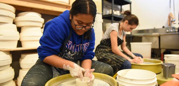 Senior School students using the pottery wheel