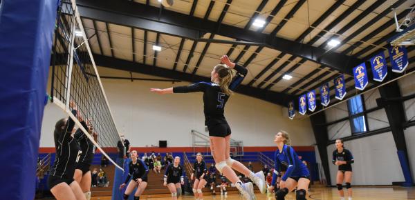 Senior Girls Volleyball game in the gym