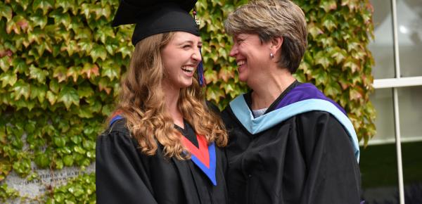 SMUS graduate and teacher share a happy moment