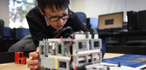 Middle School student working on a LEGO robotics project