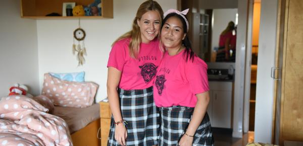 Two Senior School boarding students pose in their room.