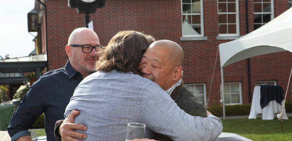 two old friends embrace at the 2022 35+ year reunion