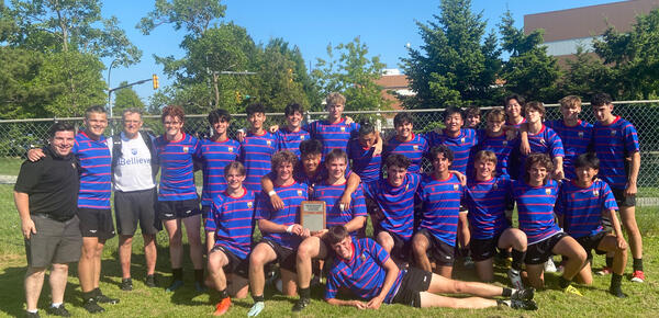 Senior Boys Rugby team pose with their trophy