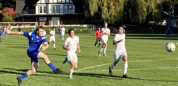 A SMUS player takes a shot at goal