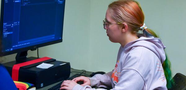 Game Development Camper working on her project