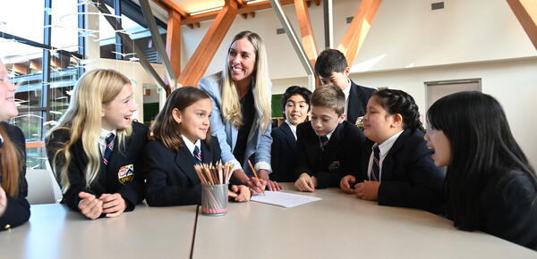 Becky Anderson with Grade 5 students in the atrium