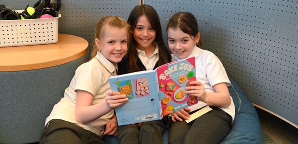 Grade 5 students reading in the library