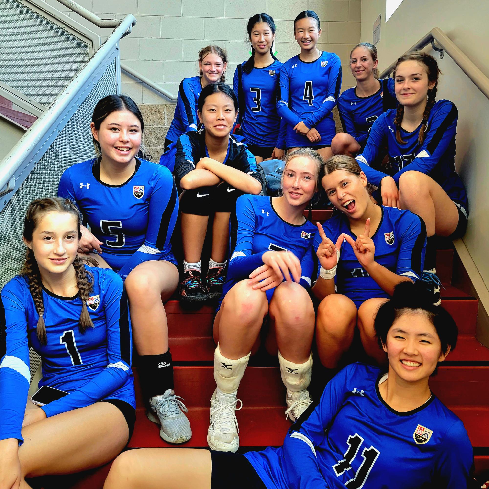 The Junior Girls Volleyball team poses together after a win at the Camosun tournament