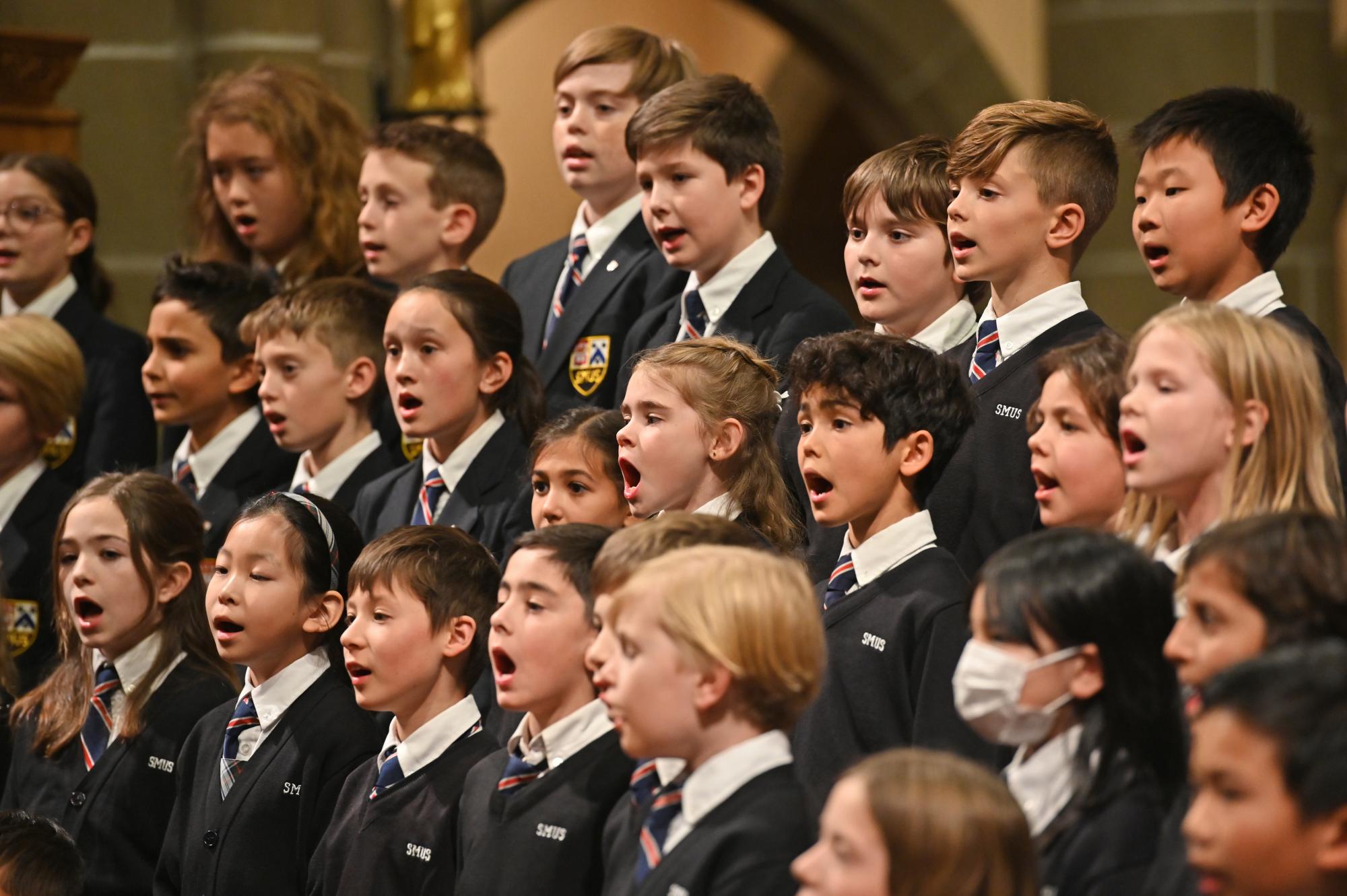 Junior School singers perform a choral song during the Carol Service
